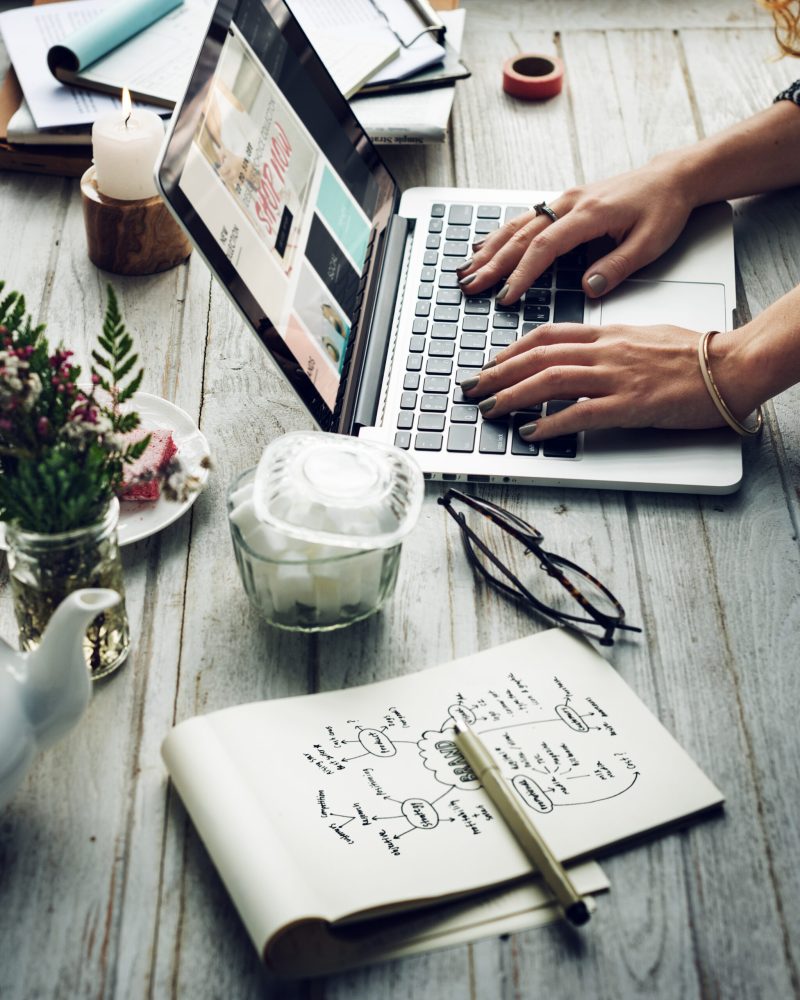 Side view of woman using computer laptop